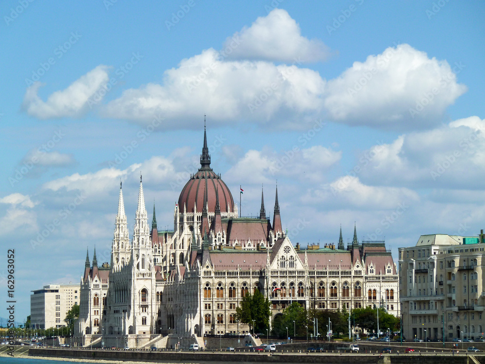 Budapest Hungarian parliment with sun and clouds