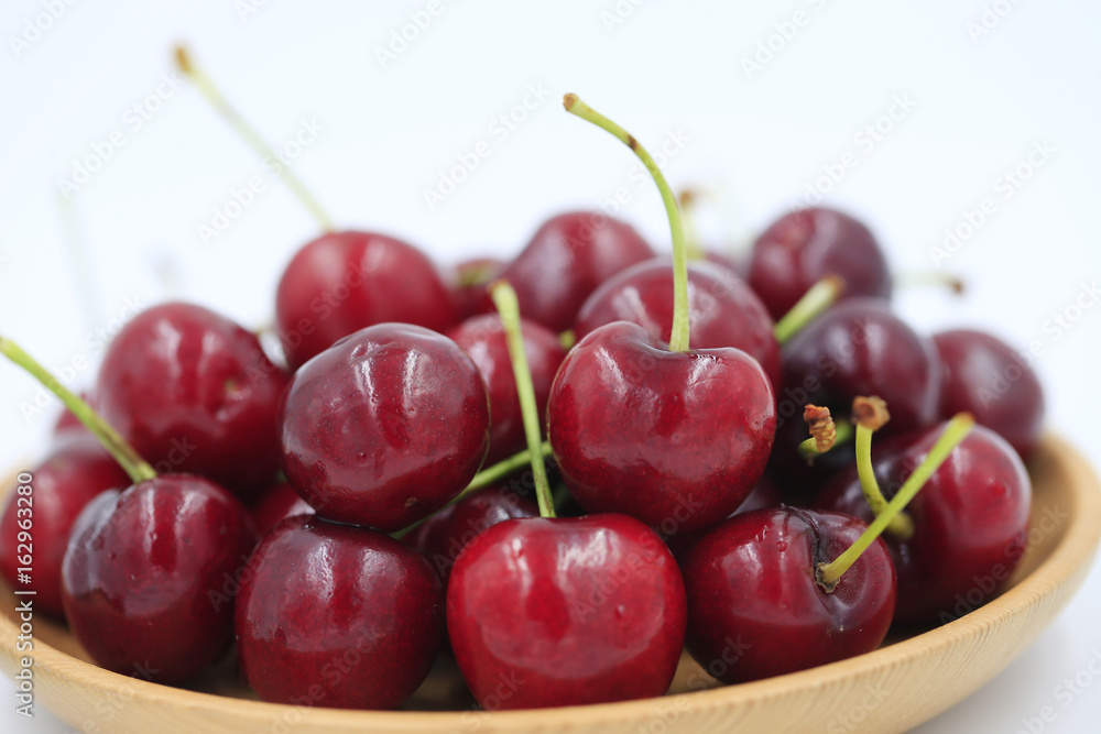 The big cherries are on a white background The big cherries are on a white background