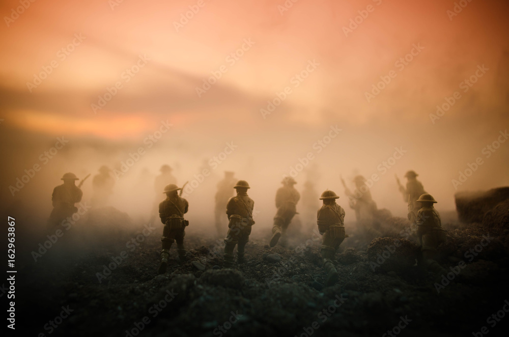 War Concept. Military silhouettes fighting scene on war fog sky background, World War Soldiers Silhouettes Below Cloudy Skyline At night. Attack scene. Armored vehicles. Tanks battle - obrazy, fototapety, plakaty 