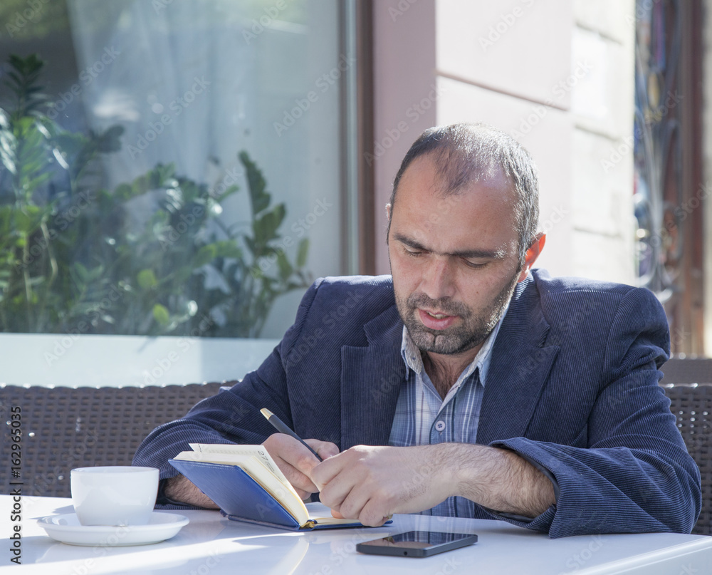 businessman planning his workday. Time management concept. (Freedom, freelance, success, money) businessman planning his workday. Time management concept. (Freedom, freelance, success, money)