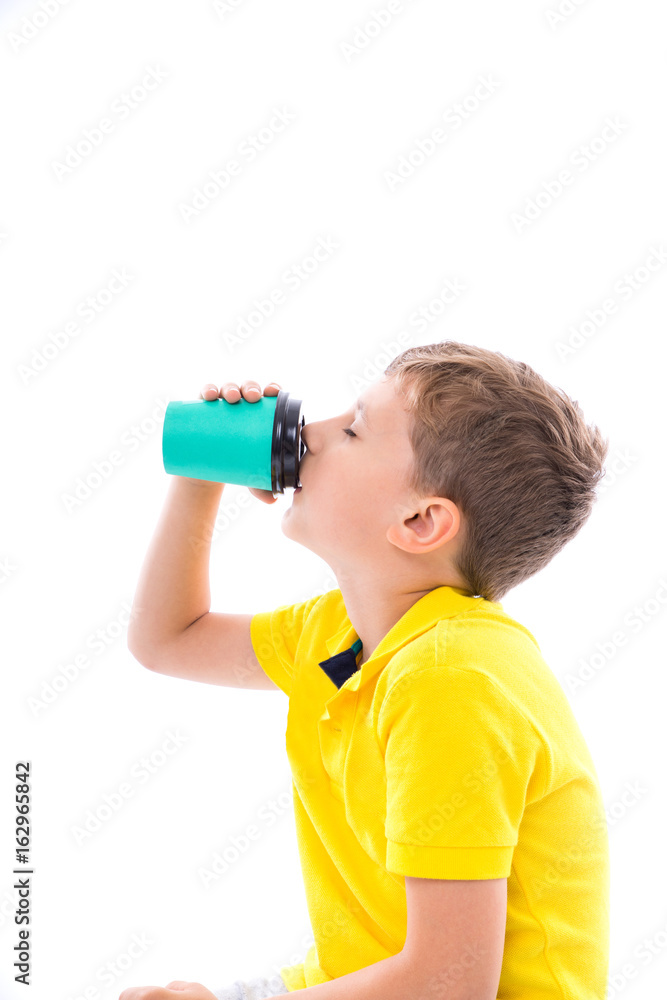 young boy drink a cup of milk