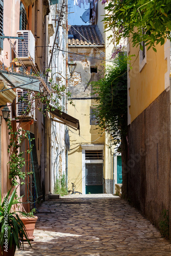 Narrow empty streets of Corfu island, Greece. Buildings on sides. Daylight view