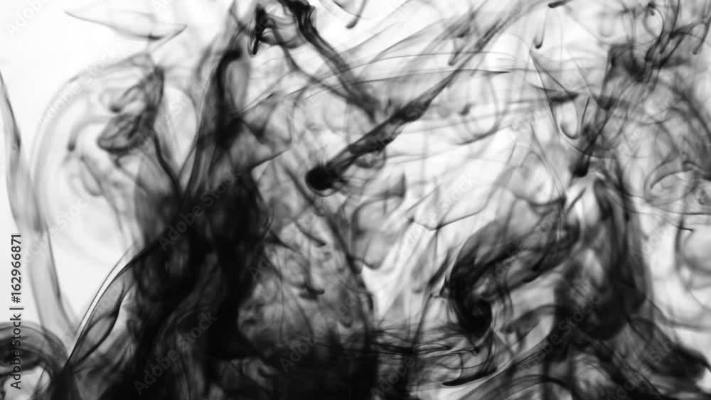 Black ink dissolves in water. Slow motion Black ink dissolves in water. Slow motion