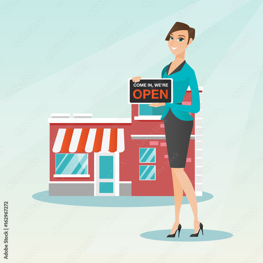 Caucasian shop owner holding open signboard. Caucasian shop owner holding open signboard.