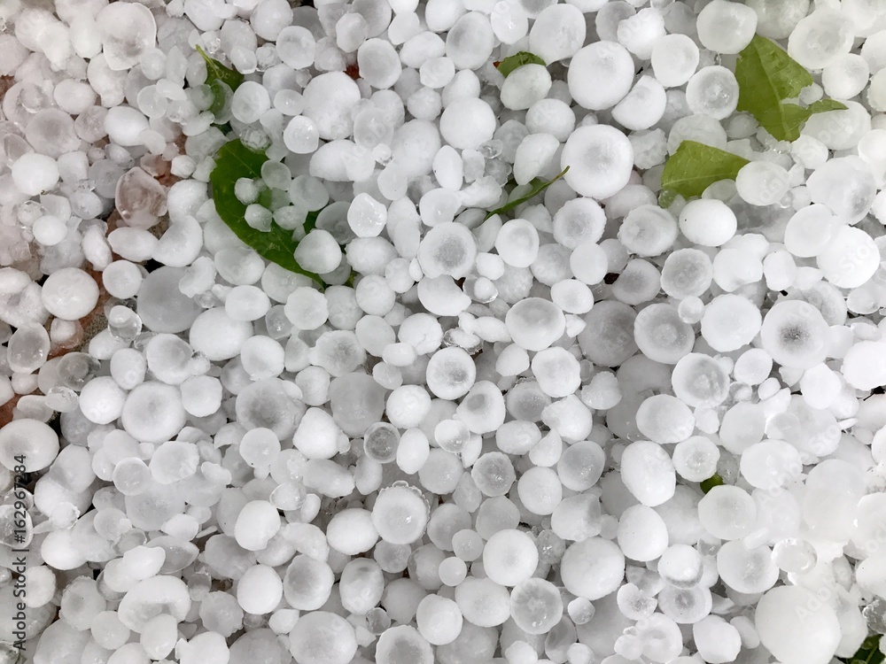 Hail stones on the ground after a thunderstorm Hail stones on the ground after a thunderstorm