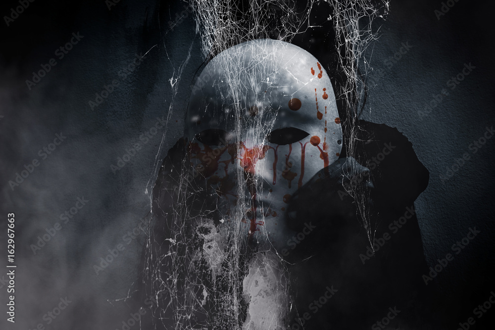 Mysterious person showing white mask in the dark,Scary background for book  cover Stock Photo by ©lighthouse 117934264