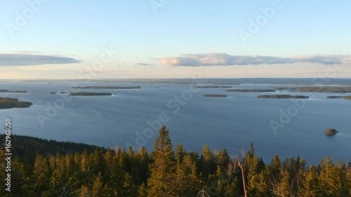 Pielinen, Time lapse view of a sunset above lake pielinen, filmed from koli mountain, on a spring evening, in Lieksa, Karelia, Finland photo