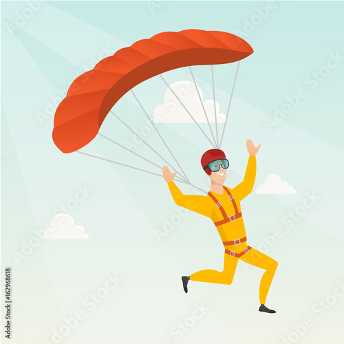 Young caucasian skydiver flying with a parachute.