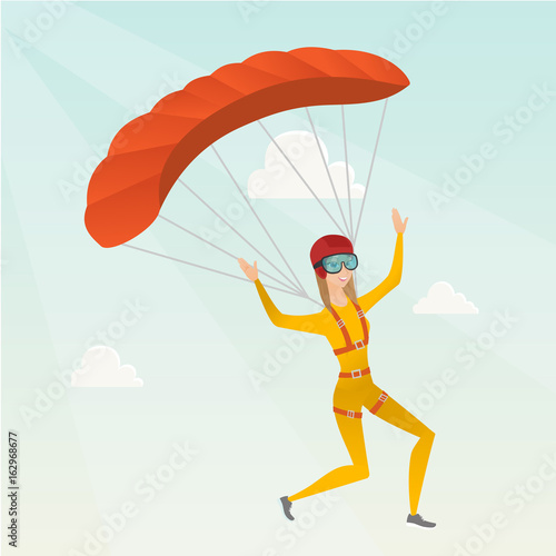 Young caucasian skydiver flying with a parachute.