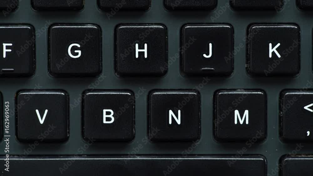 Black computer keyboard detail view closeup. Motorized slider 4K ProRes HQ codec Black computer keyboard detail view closeup. Motorized slider 4K ProRes HQ codec