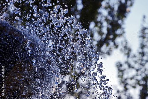 the blurred drops of water spray fountain