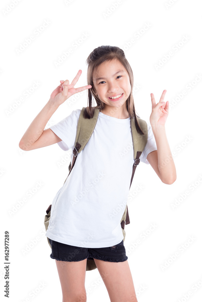 Young asian schoolgirl standing over white background