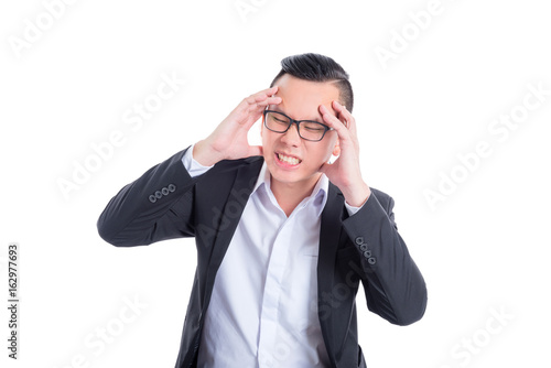 Young asian businessman having headache over white background