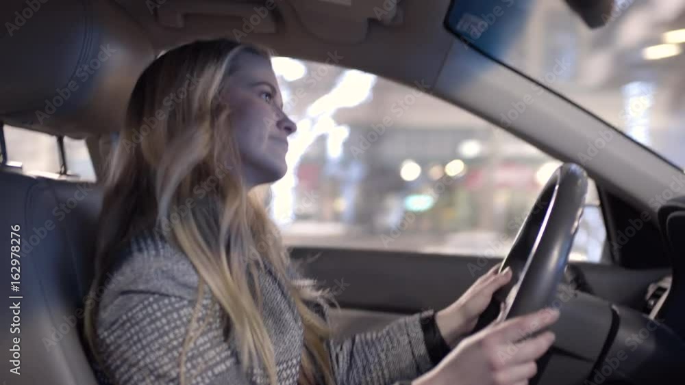 Carefree Young Woman Sings And Dances While She Drives Down City Street Carefree Young Woman Sings And Dances While She Drives Down City Street
