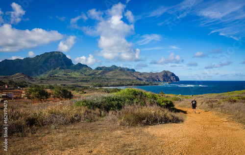 Hiker on Maha' elepu Heritage Trail, near Shipwreck Beach, Koloa, Kauai, Hawaii, USA photo