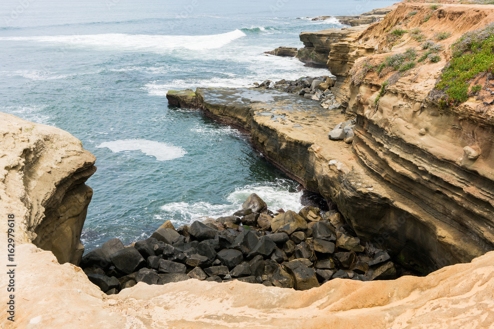 Sunset Cliffs in San Diego with waves crashing on rocks