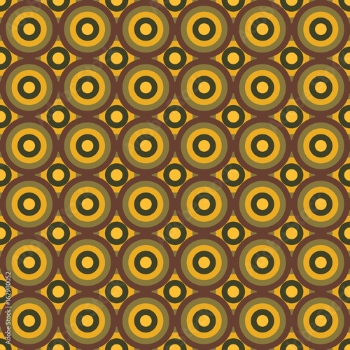 Seamless colorful pattern made by circles in shades of brown and yellow - old vintage stylization