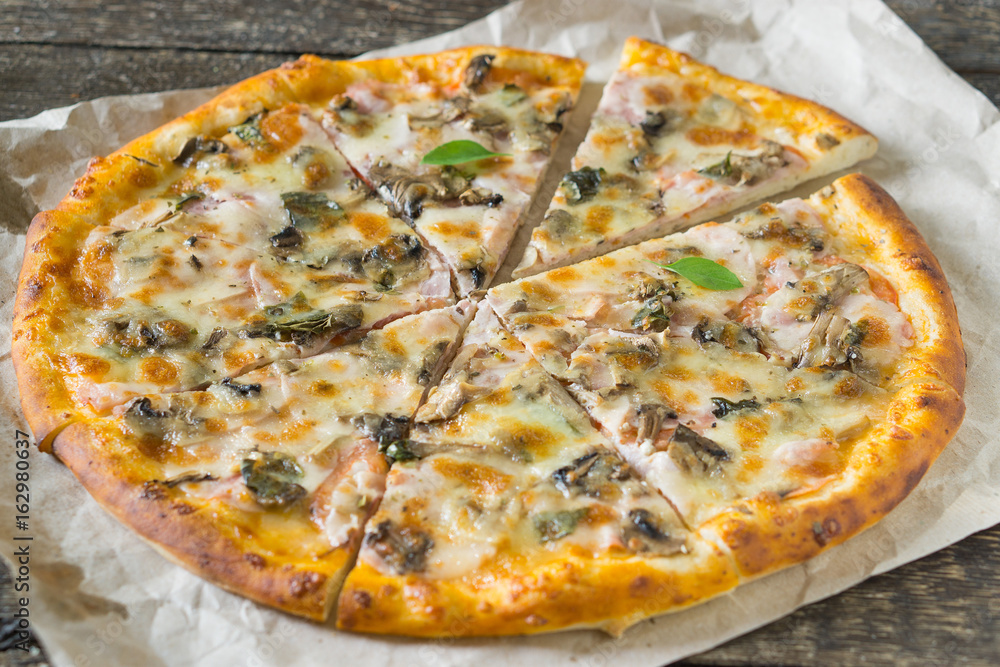 Pizza on rustic background