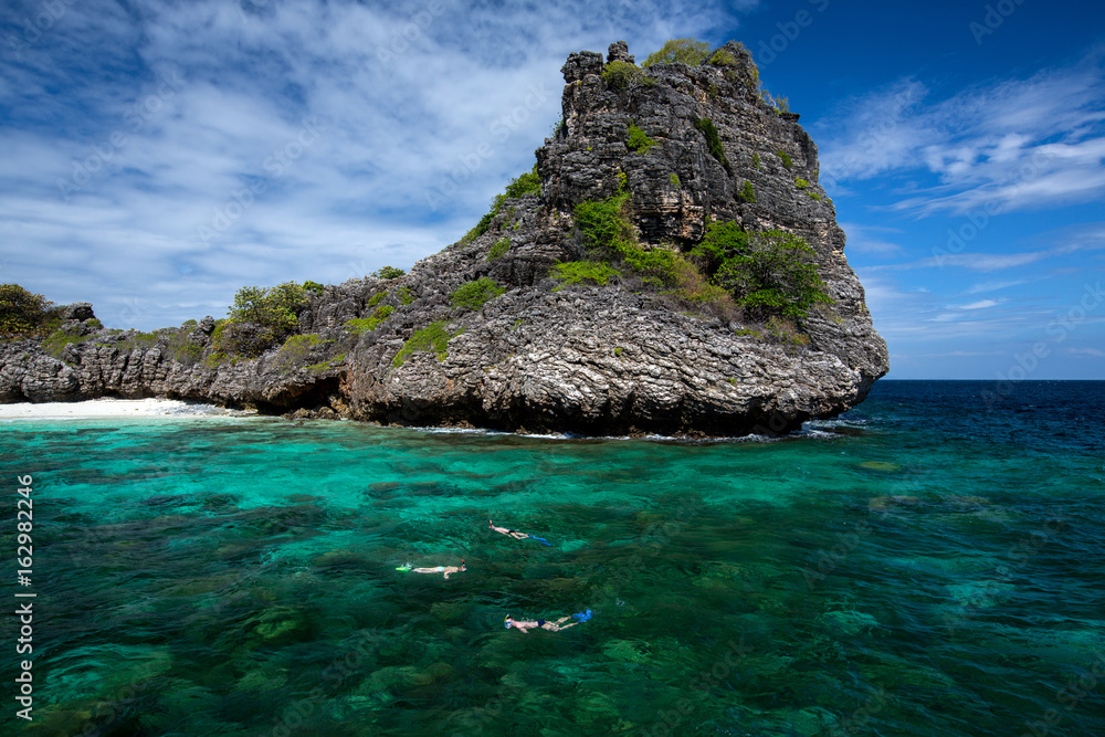 snorkeling diver swim at underwater with coral reef . Travel lifestyle, background Island and tropical beach, Koh Hayai Island, Andaman Sea , Thailand