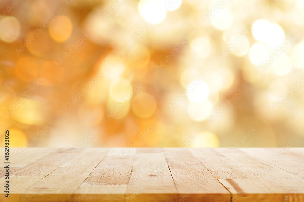 Wood table top on golden bokeh background Wood table top on golden bokeh background