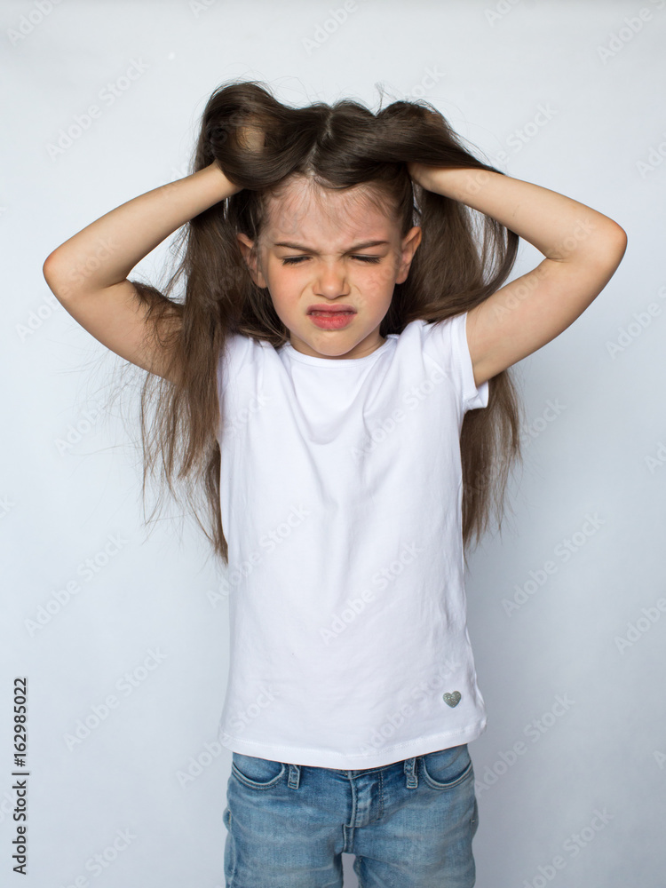 little angry girl, isolated on a white background