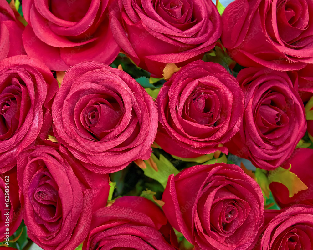 purple fake roses top view, floral background purple fake roses top view, floral background