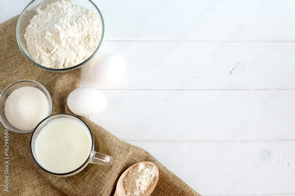 Flour and eggs on a white background. Cooking dough Flour and eggs on a white background. Cooking dough