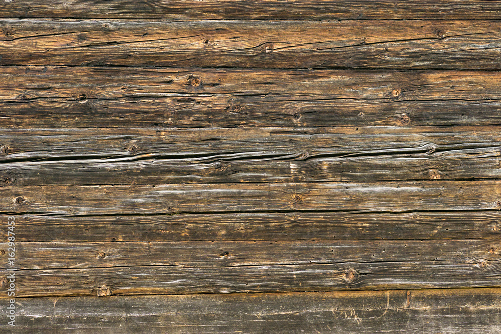 Natural brown barn wood wall. Wall texture background pattern. Natural brown barn wood wall. Wall texture background pattern.