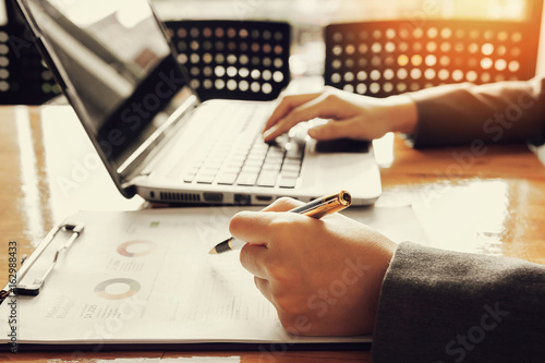 Administrator business man financial inspector and secretary making report, calculating or checking balance.
