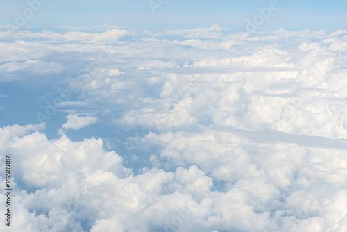 Blue sky and Clouds as seen through window of aircraft