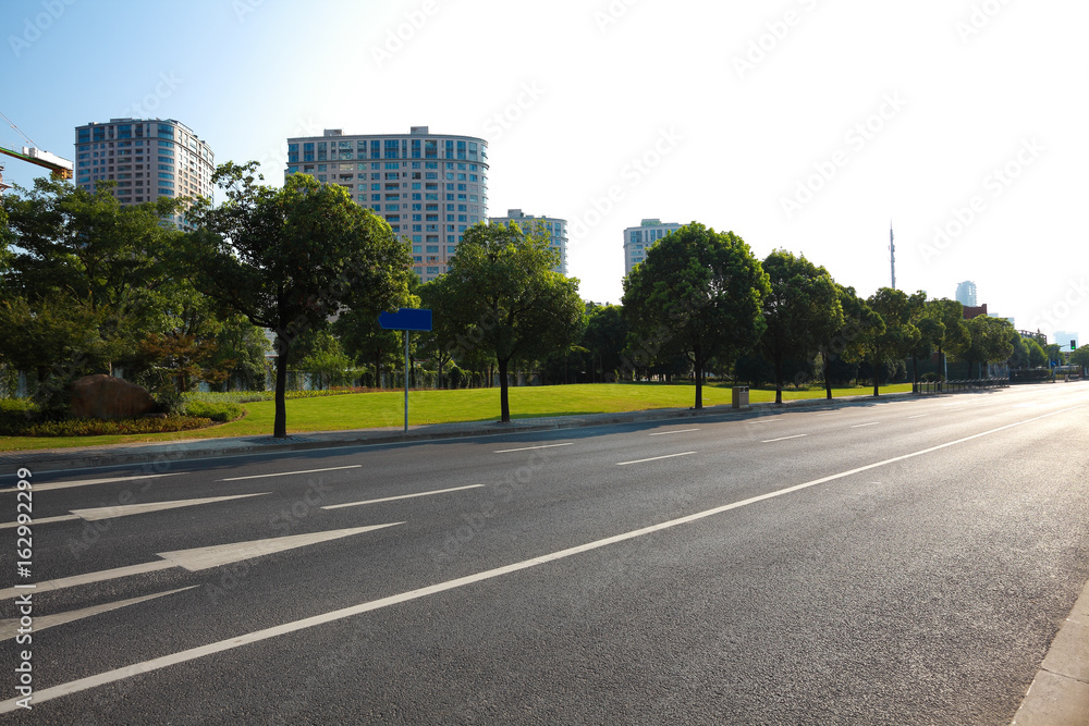 Empty road surface floor with buildings background