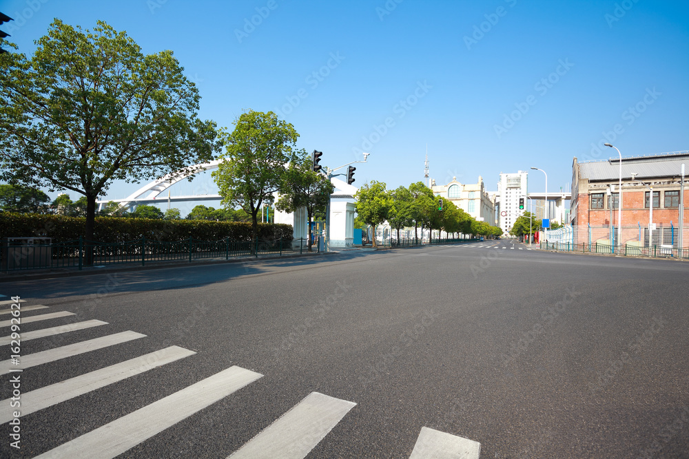 Empty road surface floor with buildings background
