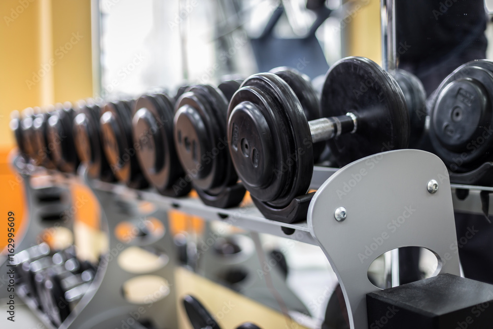 dumbbells row in fitness center dumbbells row in fitness center