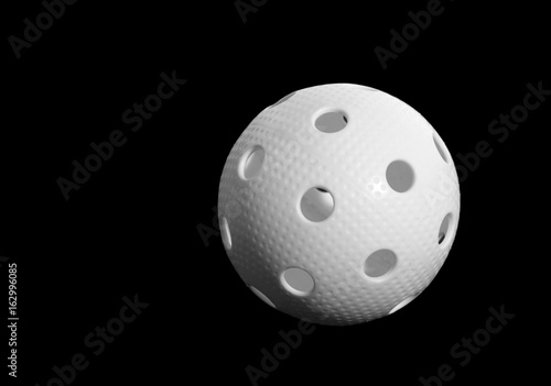 Fotografie Floorball ball isolated on black