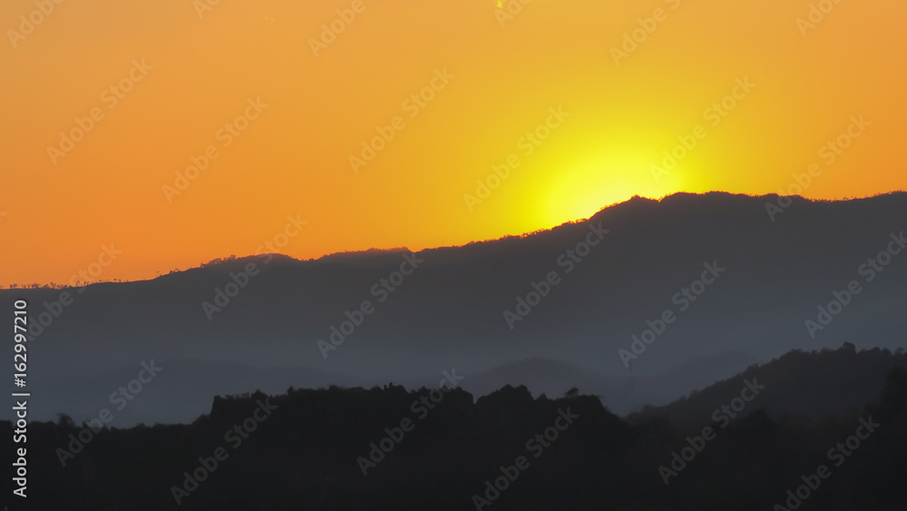Sunrise behind the mountain, motivation concept