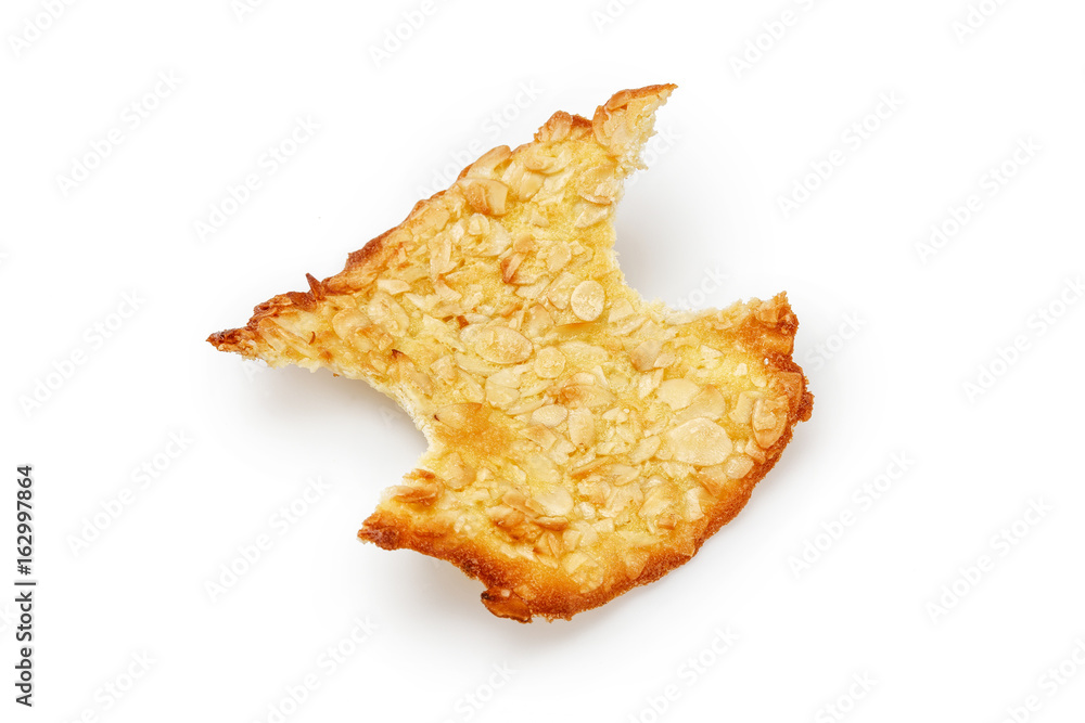 Bite off a piece of almond from both side cookie isolated on white