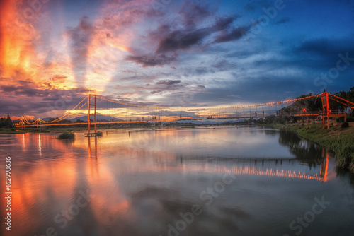 Landscape of sunset bridge crossing Ping river at Tak ,Thailand