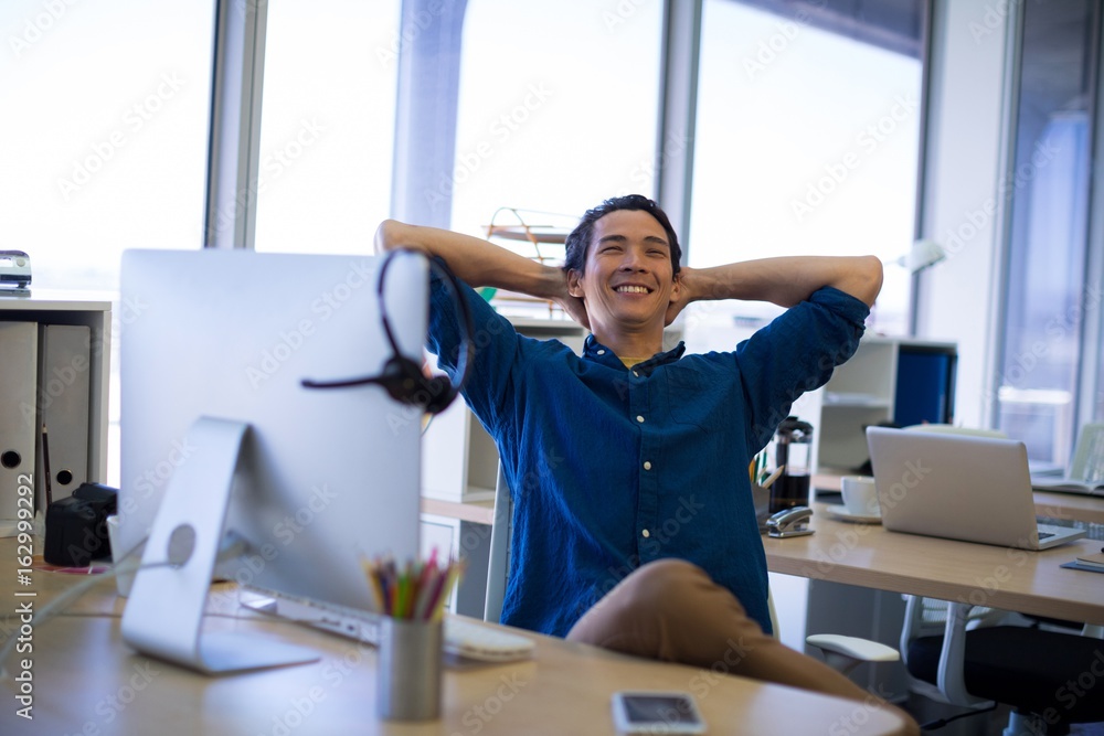 Male executive relaxing at his desk Male executive relaxing at his desk