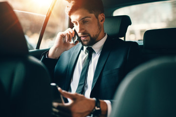 Young business working during travelling to office
