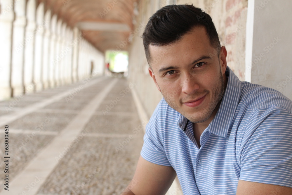 Fototapeta premium Cute boy smiling outdoors close up with copy space