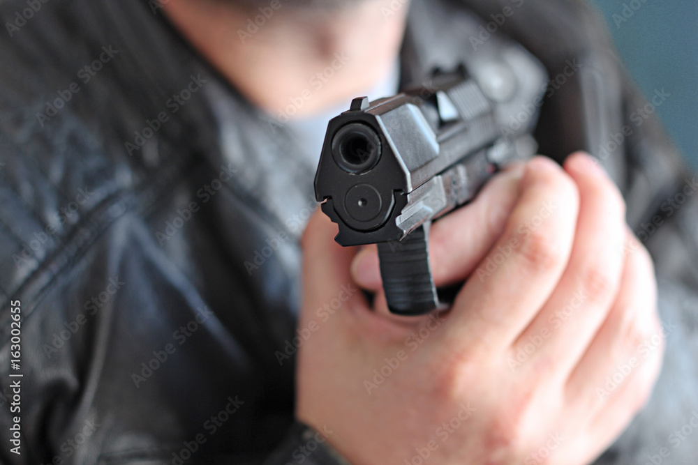 man with hand gun pistol rubber attack violence man with hand gun pistol rubber attack violence
