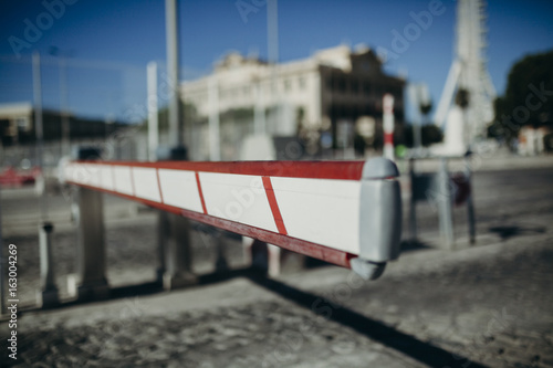 Vehicle access barrier. Urban background.
