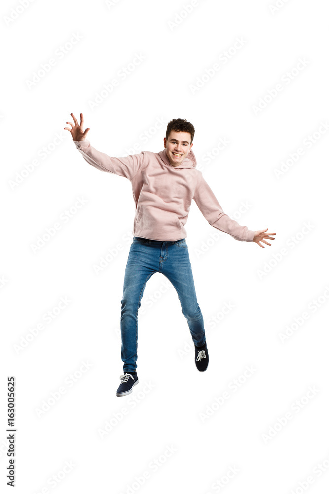 Young man jumping on white background Young man jumping on white background