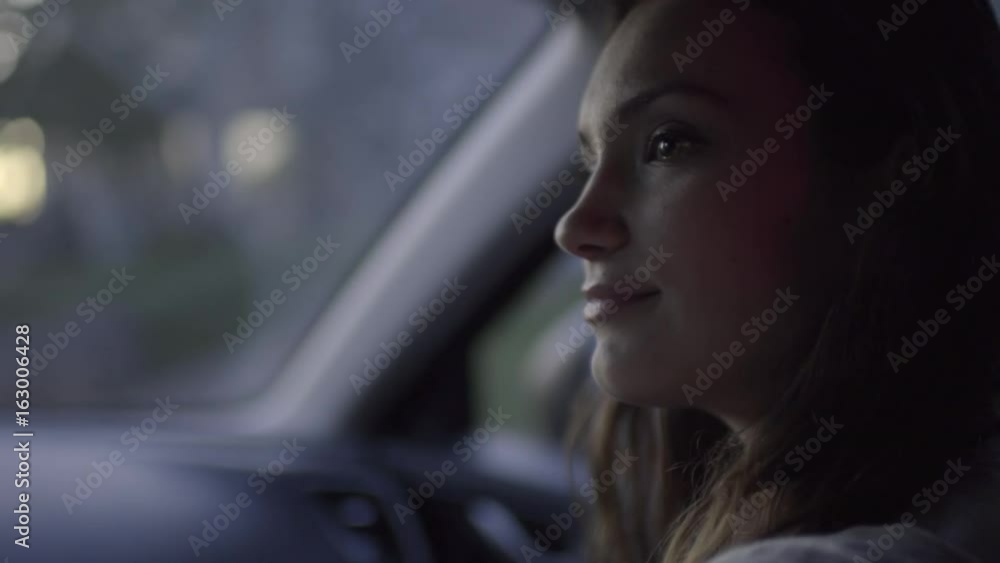 Closeup Of Young Woman In Passenger Seat, She Looks At Driver Lovingly, She Reaches Out To Them (Slow Motion) Closeup Of Young Woman In Passenger Seat, She Looks At Driver Lovingly, She Reaches Out To Them (Slow Motion)