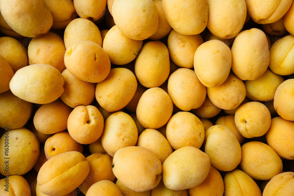 Ripe apricot fruit textured close-up.