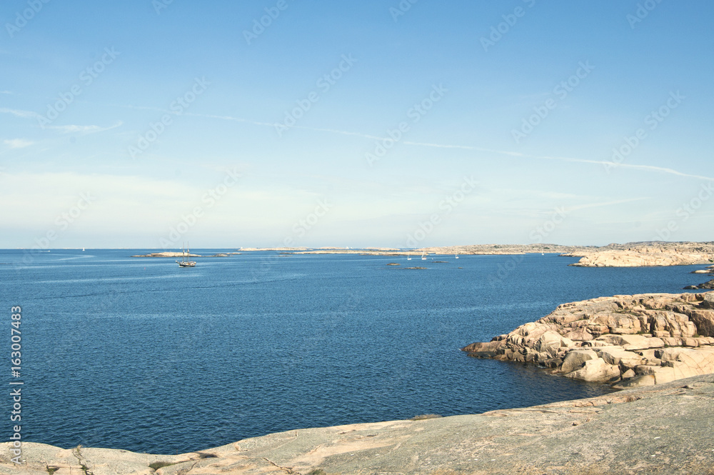 Beautiful nature landscape with nice sky, sea and vegetation. Small rocks and great colors. Marine and archipelago environment.