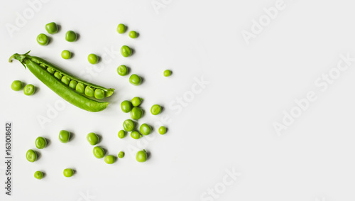 Green peas on a white background. 