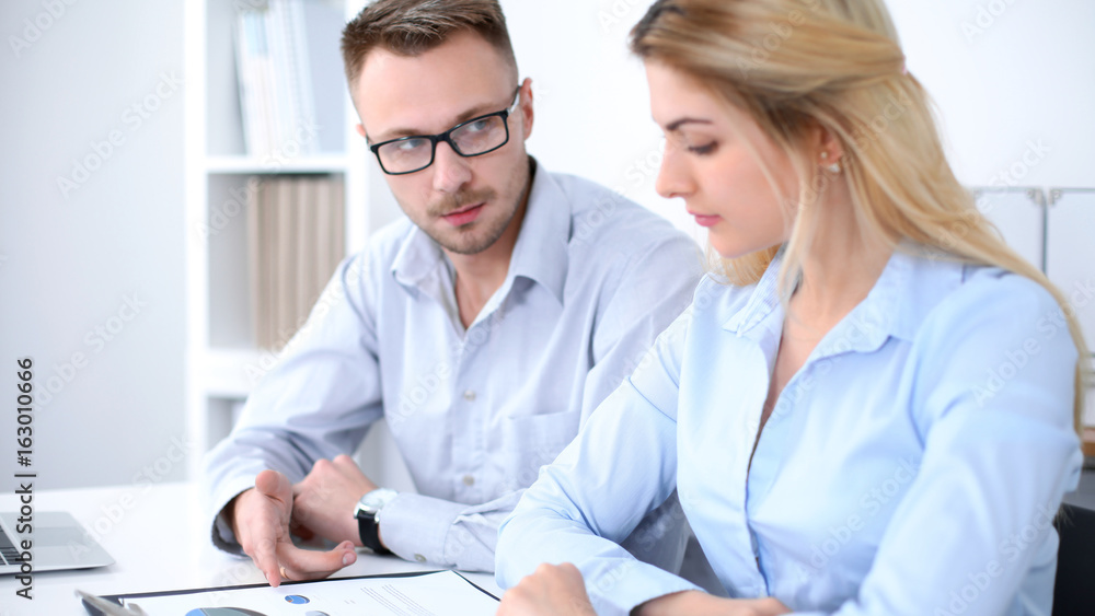 Successful business people working at meeting in office background Successful business people working at meeting in office background