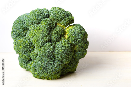 big broccoli on a wooden table