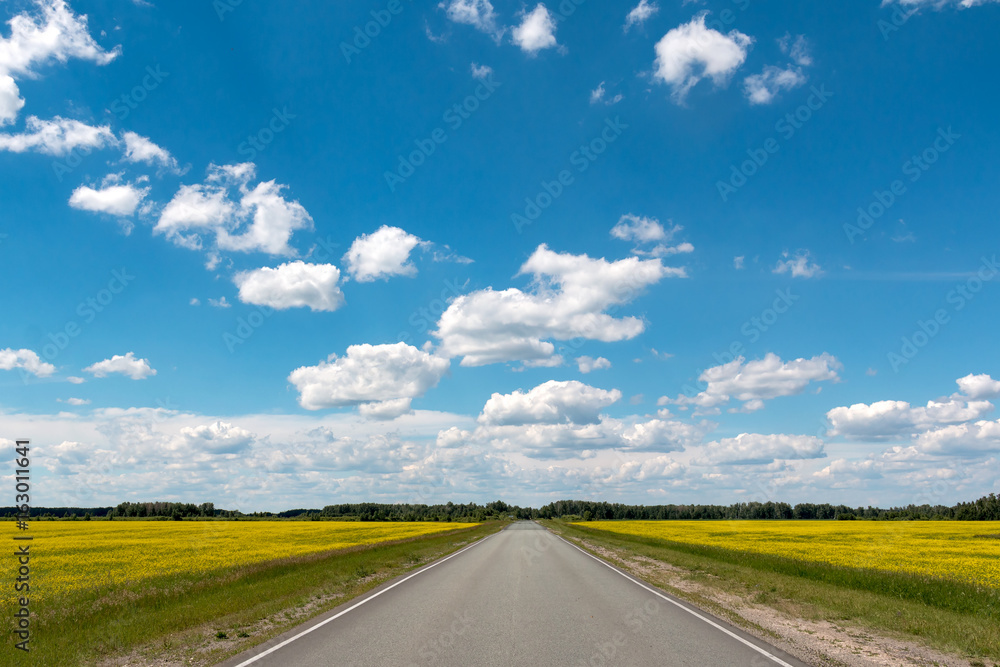 Blue sky with white clouds over the highway Blue sky with white clouds over the highway